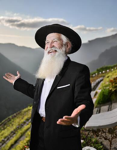 Firefly old European man with long white beard and small black cap, long black suit, with hands up i