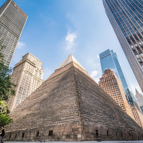 Firefly Egyptian pyramid in middle of new york city with buildings surrounding it 54304