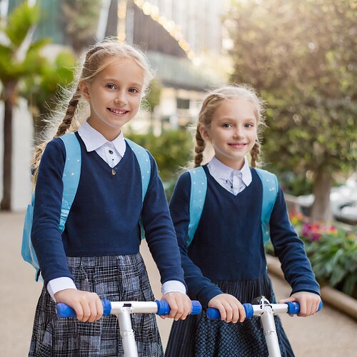 Firefly two Israeli girls with light skin and blonde braided hair wearing school blue button down bl (2)